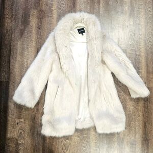 Women’s beautiful creamy white faux fur coat